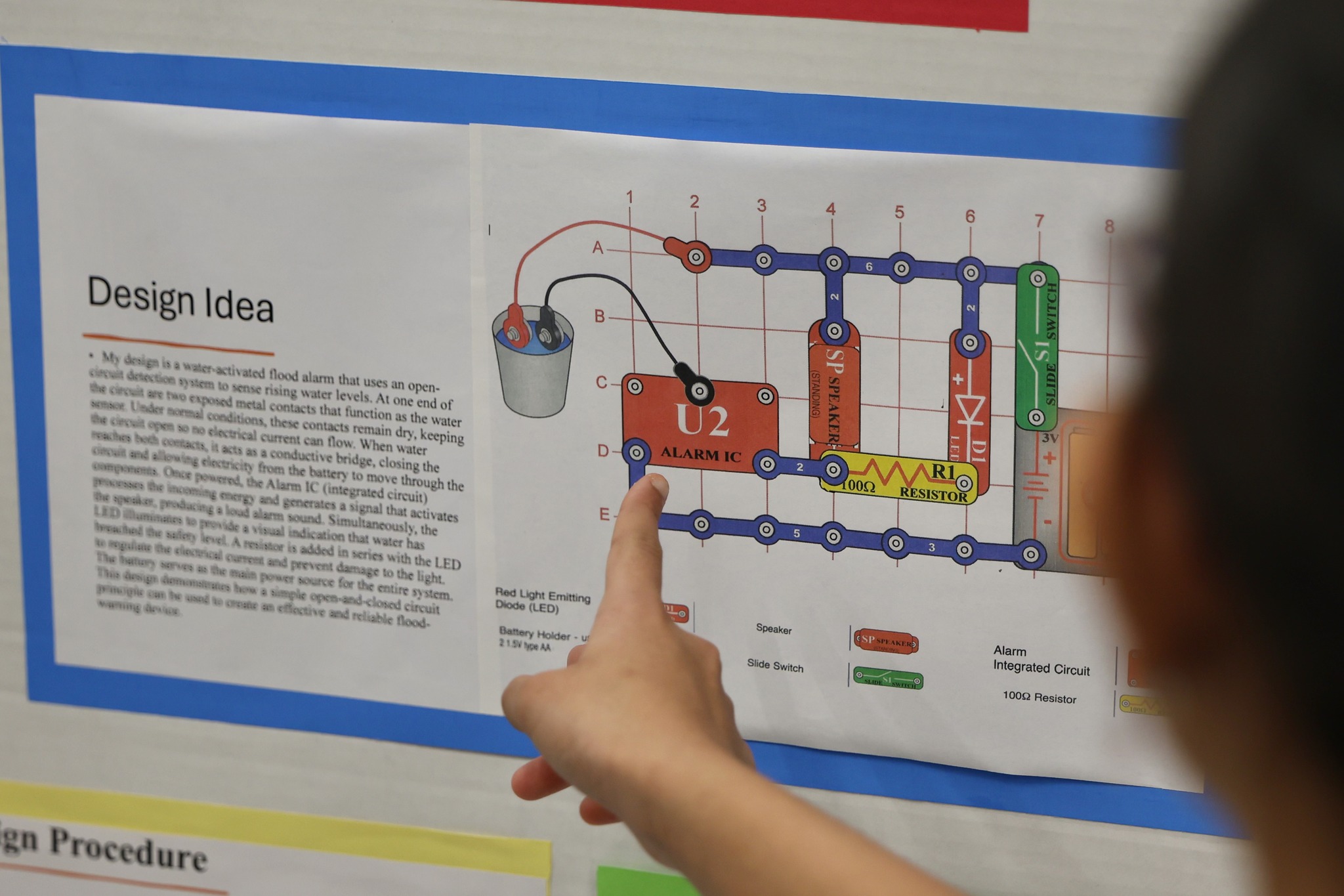student explaining project - <p>Congratulations to all of our students who participated and thank you to the organizers and judges!</p>